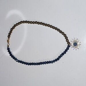 Elegant Gold and Blue Beaded Necklace with Eye Pendant
